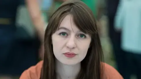 The acclaimed novelist claims she cannot travel to the UK over arrest fears